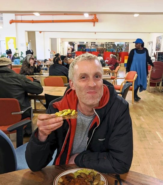 Person eating at cafe